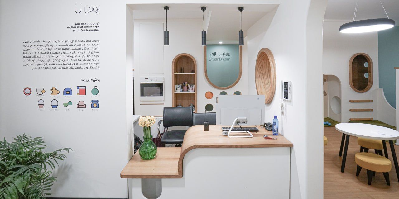 A real interior with a low counter, arch and plants