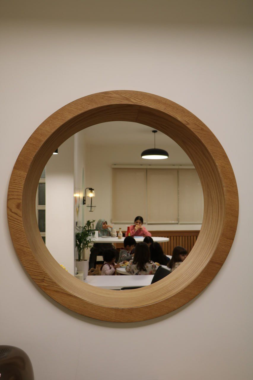 A round wooden window in a real children's space